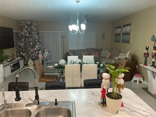 a room with a washing machine and cabinets