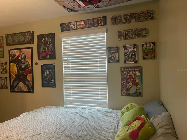 a white toilet sitting next to a shower curtain