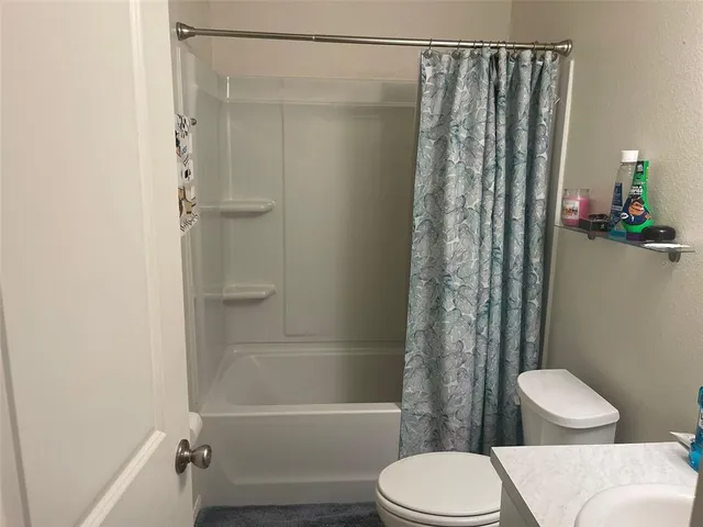 a bathroom with a sink mirror toilet and vanity