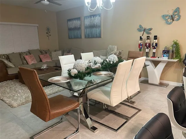 a view of living room kitchen and dining room