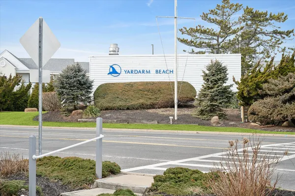 a view of a street with a building in the background