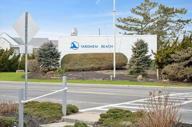 a view of a street with a building in the background