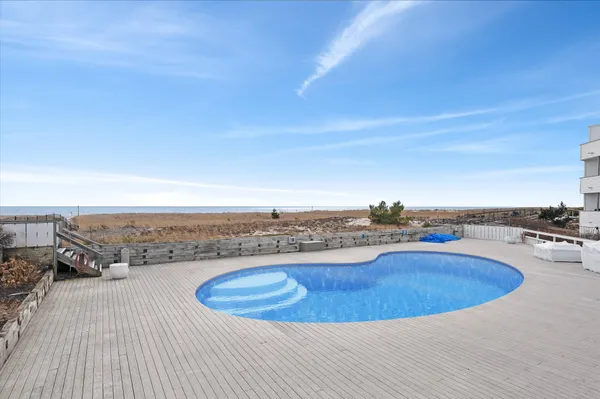 a view of a swimming pool and an ocean view