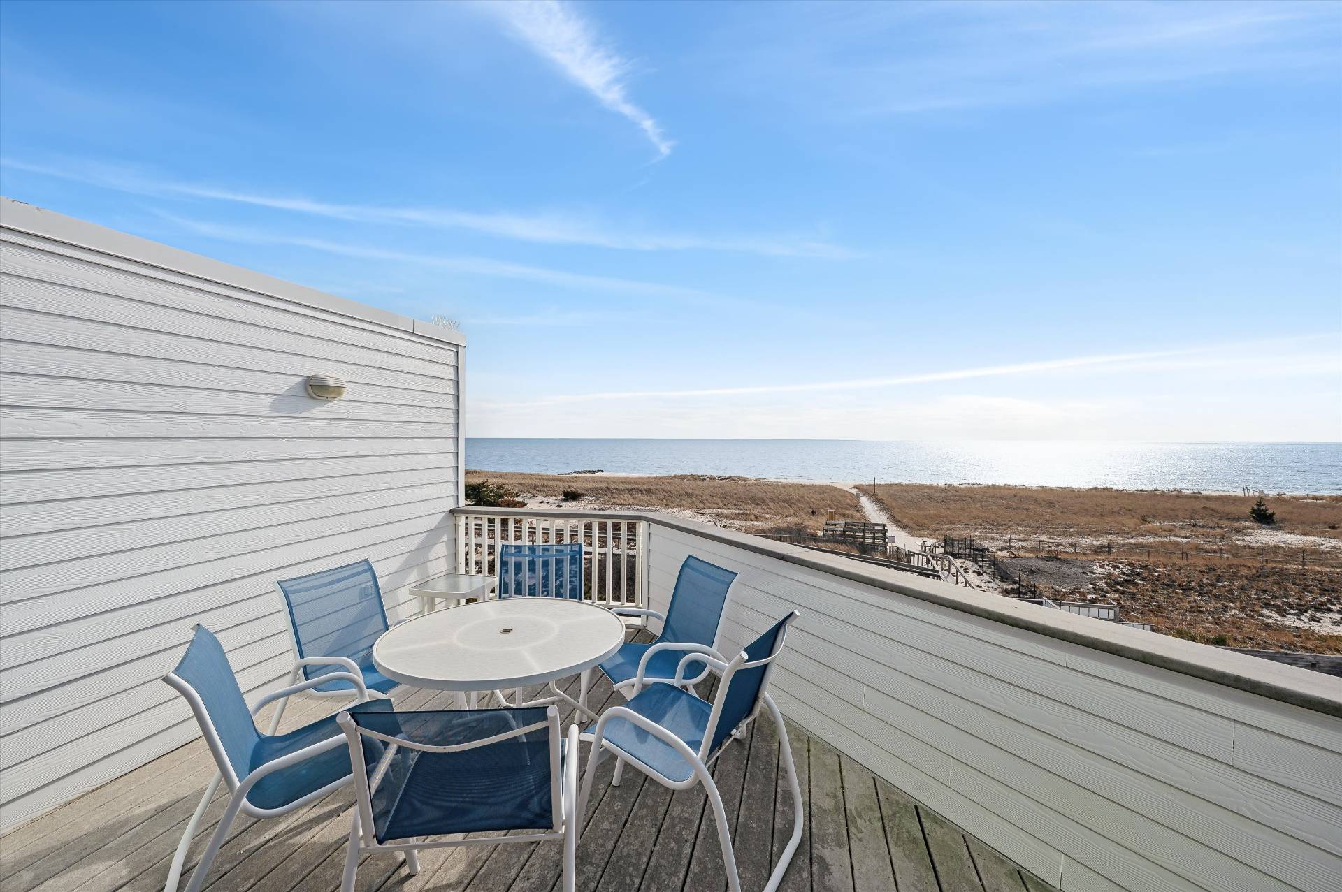 259 Dune Road, Unit 137 Westhampton Beach, NY 11978 - Photo 4 of 16 a view of a balcony with furniture
