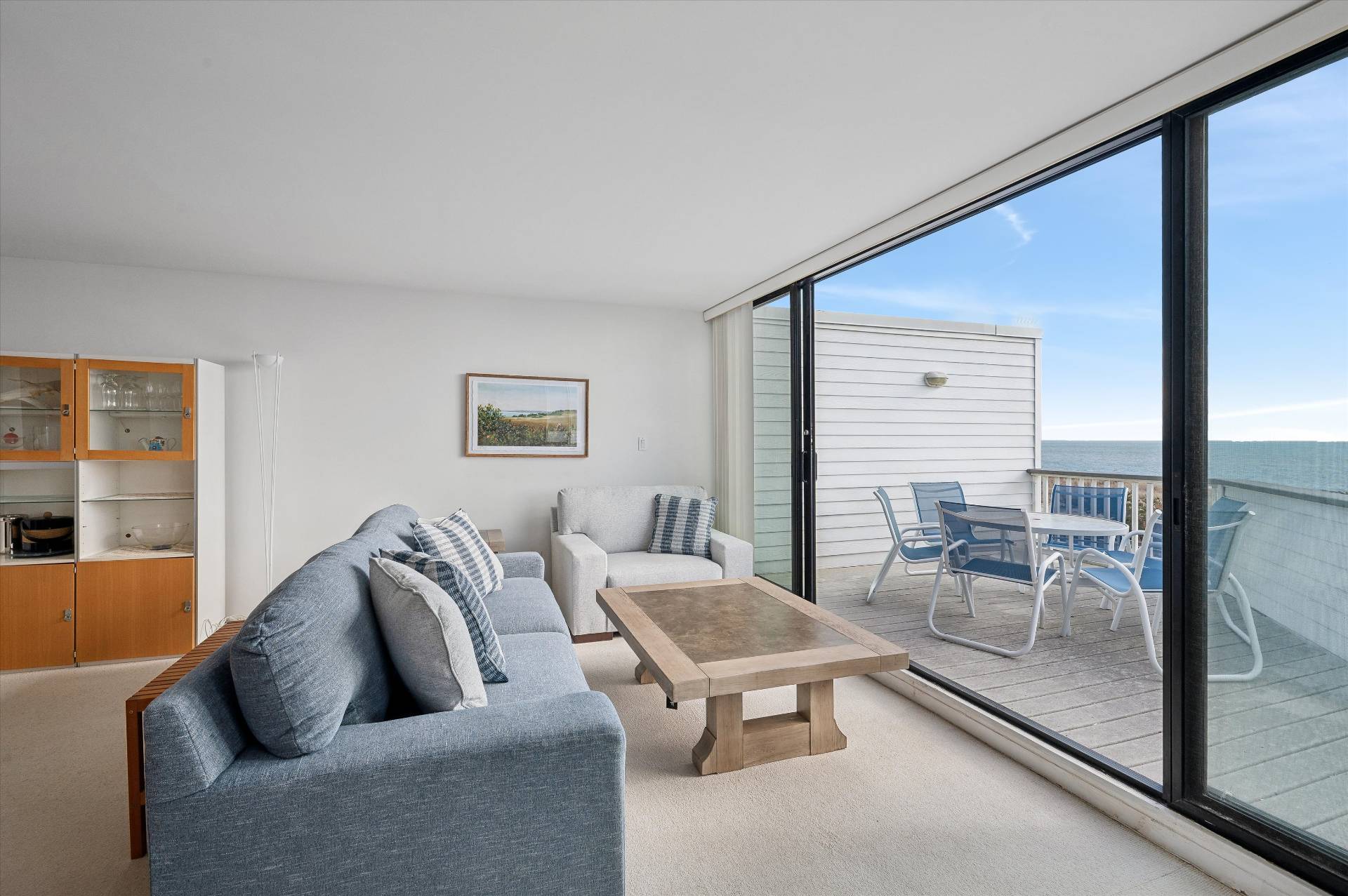 259 Dune Road, Unit 137 Westhampton Beach, NY 11978 - Photo 10 of 16 a living room with furniture