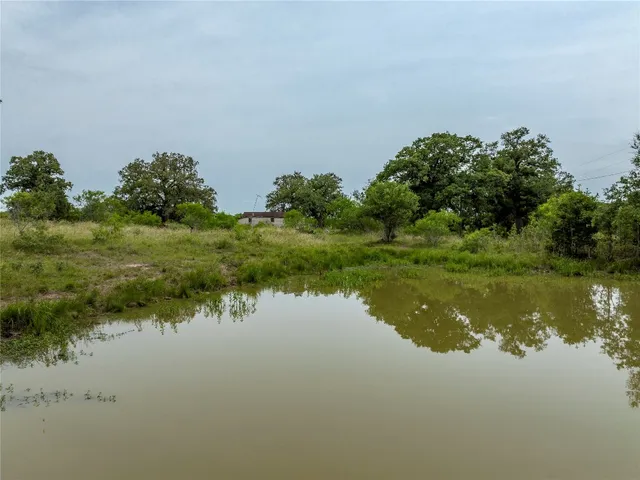 a view of a lake with a yard