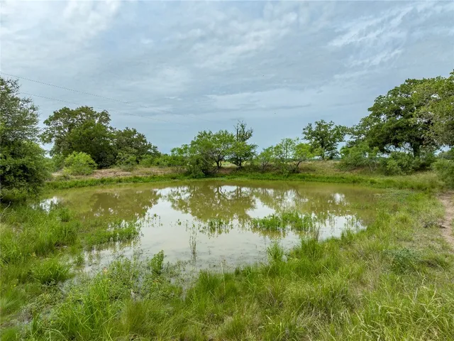 a view of a lake with a yard