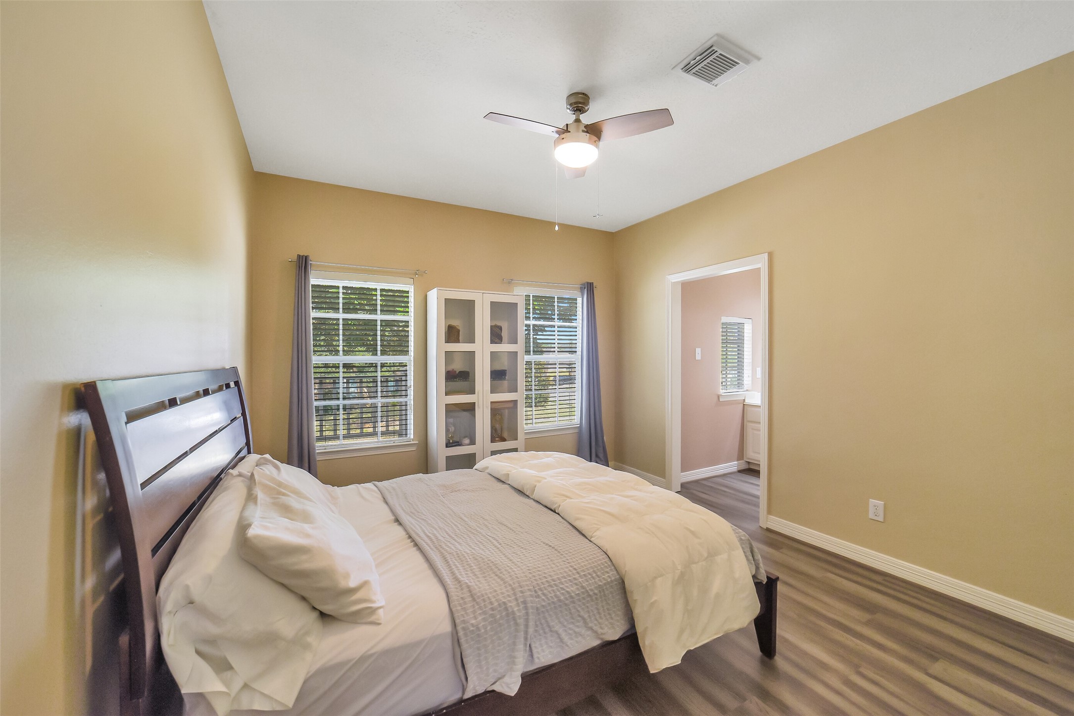 24403 Falcon Point Drive Katy, TX 77494 - Photo 24 of 32 Another spacious secondary bedroom with high ceilings and neutral finishes, offering a comfortable space for family or guests.