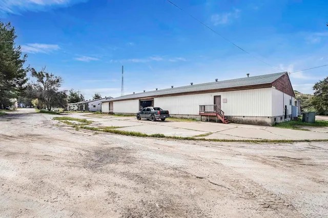 a view of a kitchen with a sink and cabinets