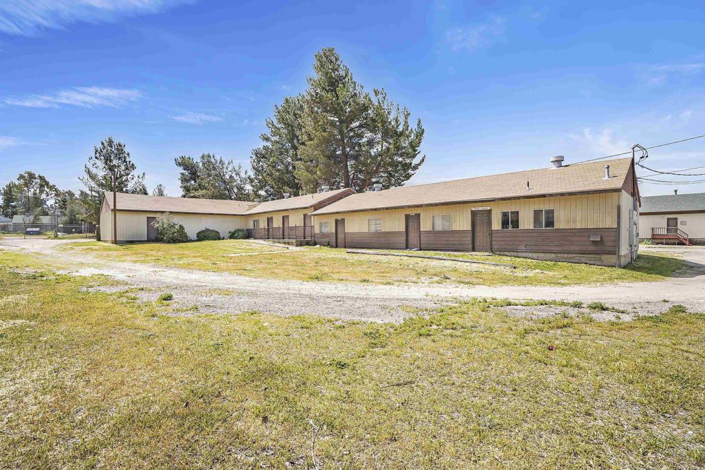 431 Jeb Stuart Road Campo, CA 91906 - Photo 18 of 33 a swimming pool with lawn chairs under an umbrella