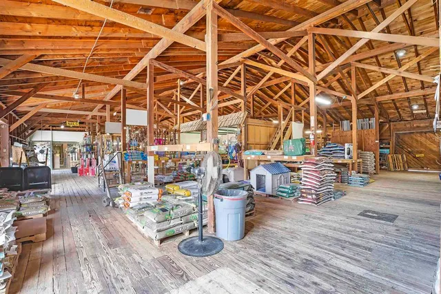 a living room with lots of furniture and a chandelier