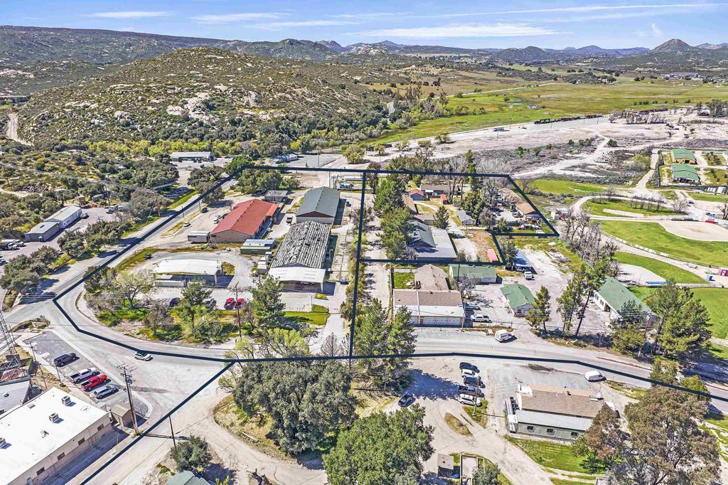 431 Jeb Stuart Road Campo, CA 91906 - Photo 4 of 33 an aerial view of a city with lots of residential buildings and mountain view in back