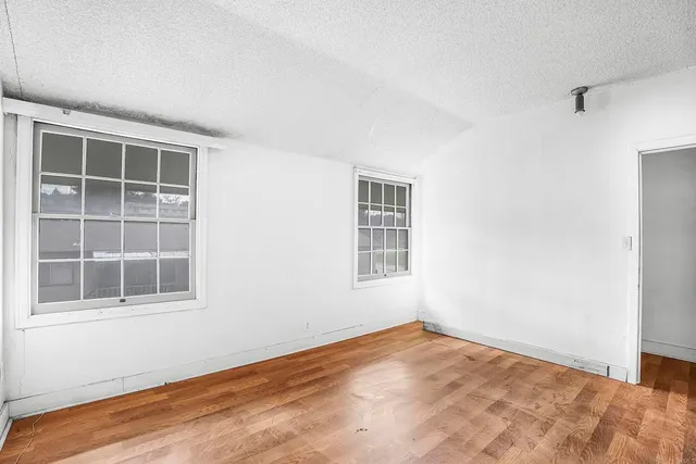 a view of empty room with windows
