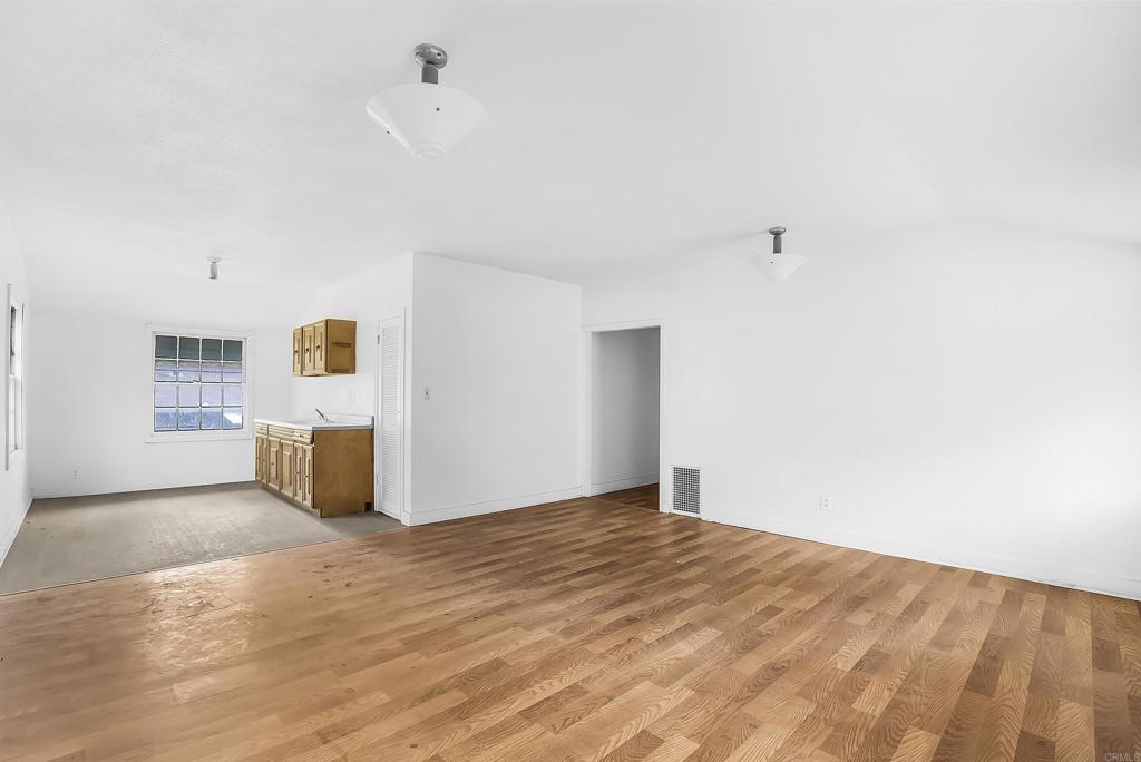 431 Jeb Stuart Road Campo, CA 91906 - Photo 10 of 33 a view of a kitchen with wooden floor and white cabinets