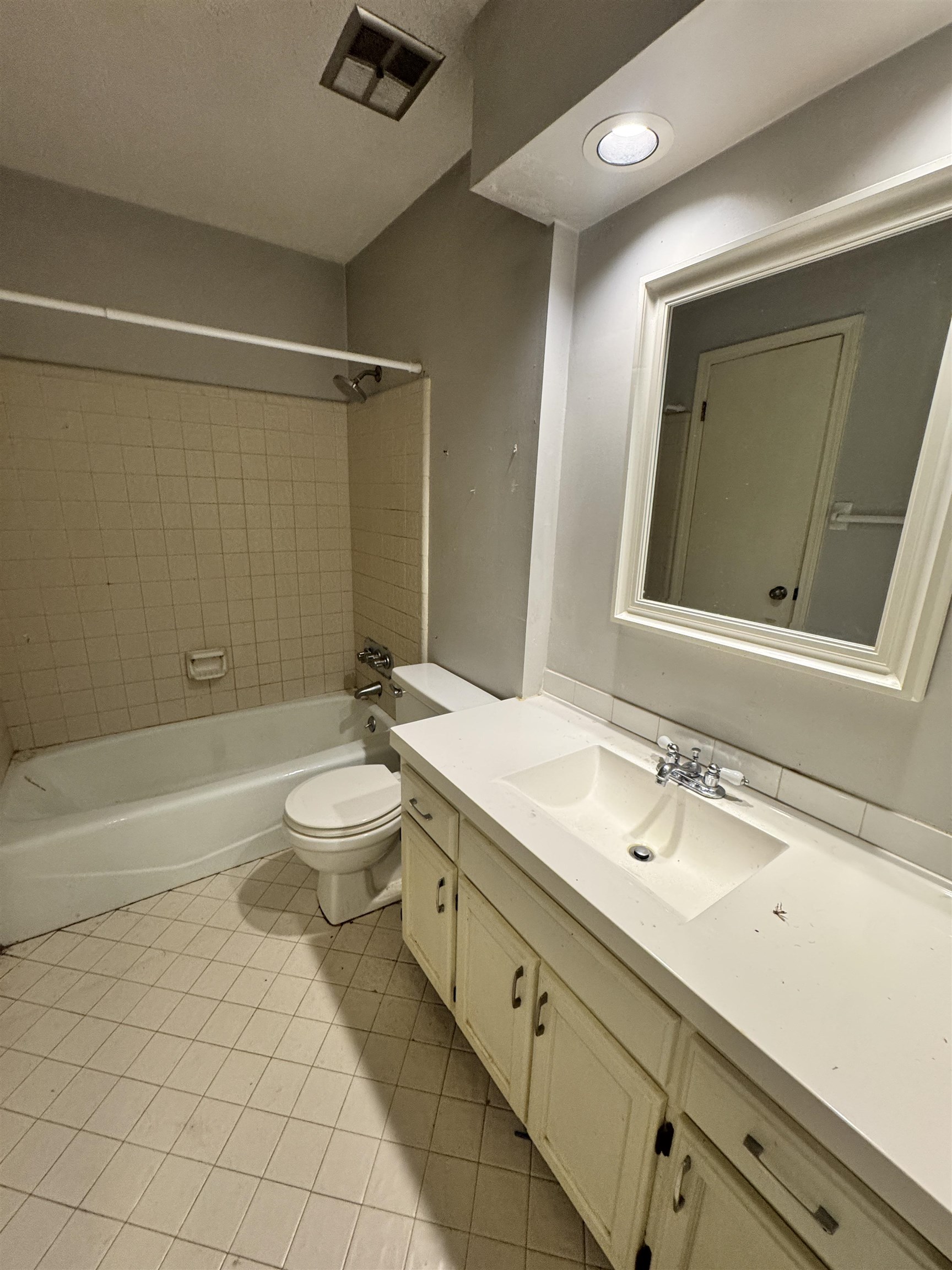 4334 Timber Rise Road Memphis, TN 38125 - Photo 14 of 18 Bathroom featuring a white vanity with integrated sink, chrome faucet, and framed mirror