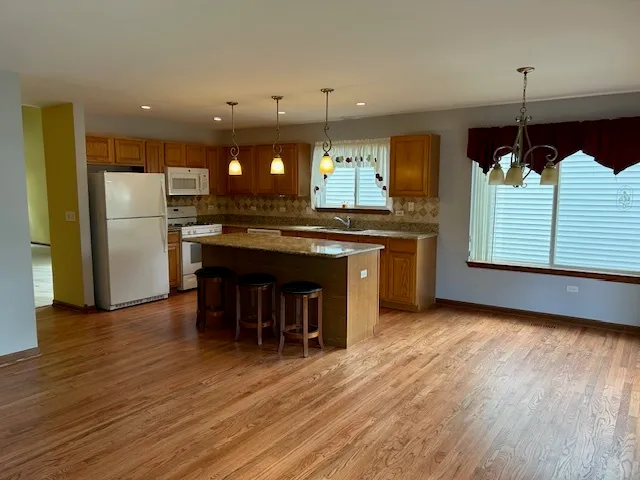 a view of a livingroom with a ceiling fan and window