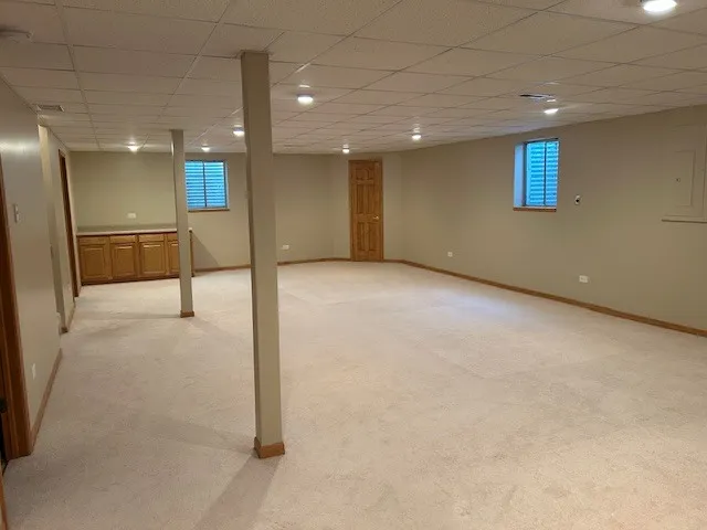 a view of an empty room with wooden walls