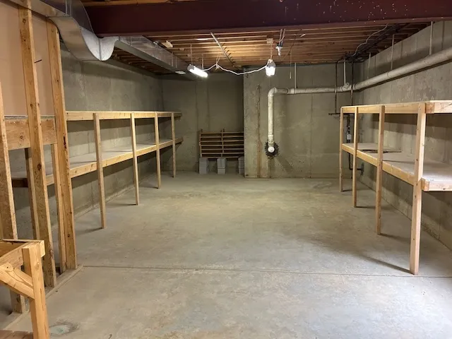 a view of an empty room with wooden roof