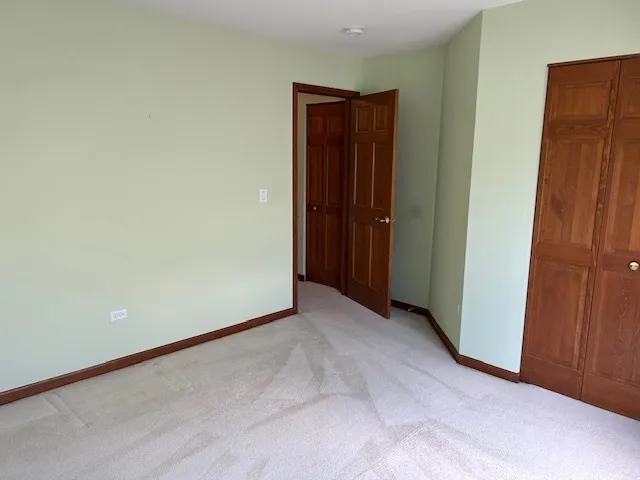 a view of an empty room with wooden walls