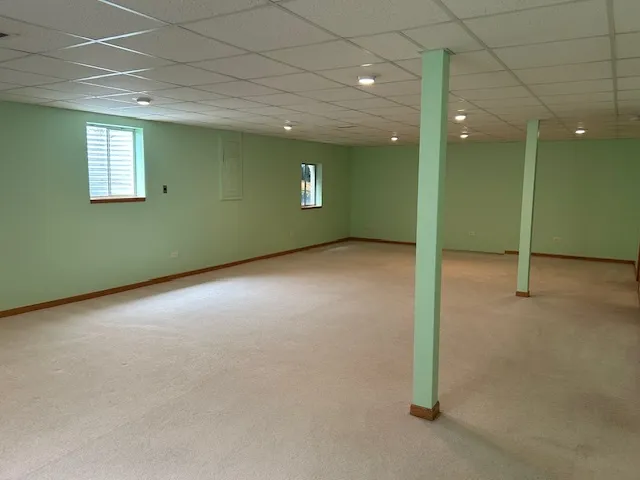 a view of an empty room with wooden roof