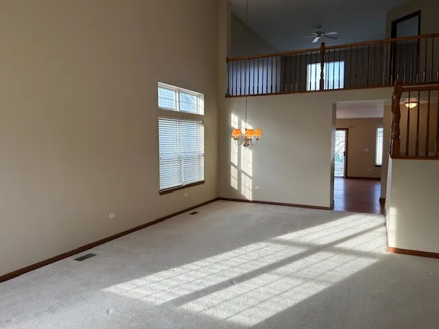 a view of a kitchen with an empty space and a window