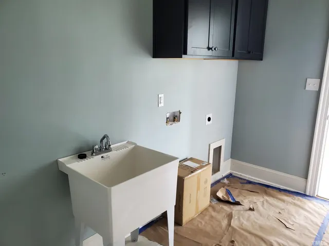 a bathroom with a sink and cabinets