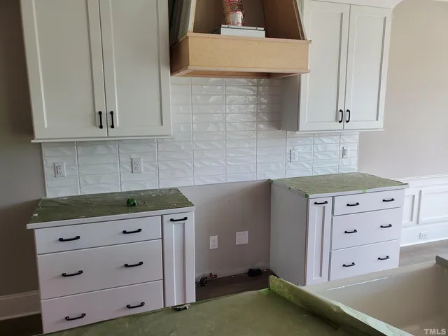 a kitchen with cabinets appliances and cabinets