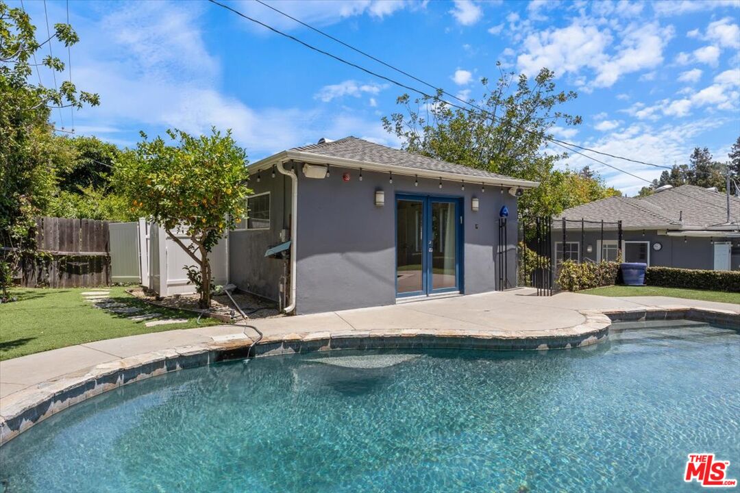 14041 Roblar Road Sherman Oaks, CA 91423 - Photo 2 of 47 a front view of a house with a garden