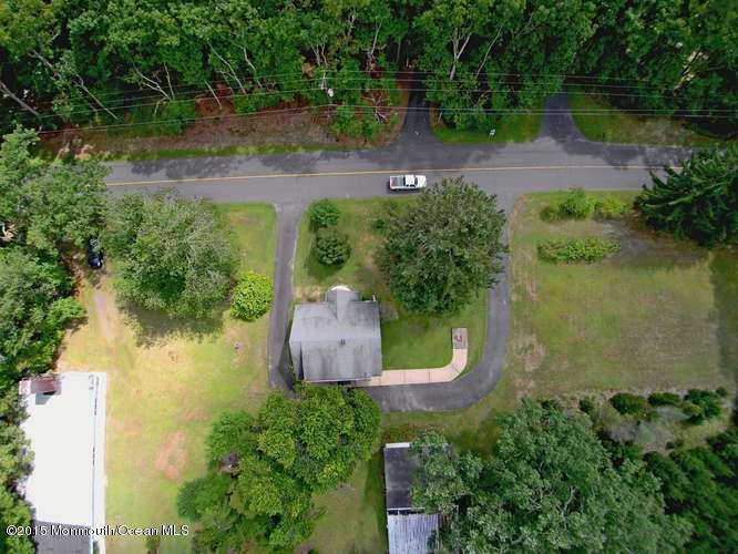 9 Brookside Road Millstone Township, NJ 08510 - Photo 2 of 10 an aerial view of a house with a yard and lake view