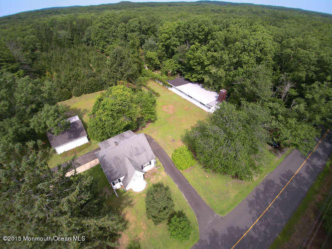 9 Brookside Road Millstone Township, NJ 08510 - Photo 3 of 10 an aerial view of residential houses with outdoor space