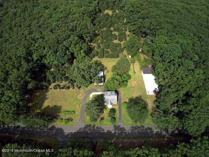 9 Brookside Road Millstone Township, NJ 08510 - Photo 7 of 10 an aerial view of a house with a yard