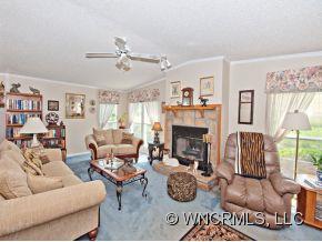 1197 Beaverdam Road Canton, NC 28716 - Photo 6 of 14 a living room with furniture and a fireplace