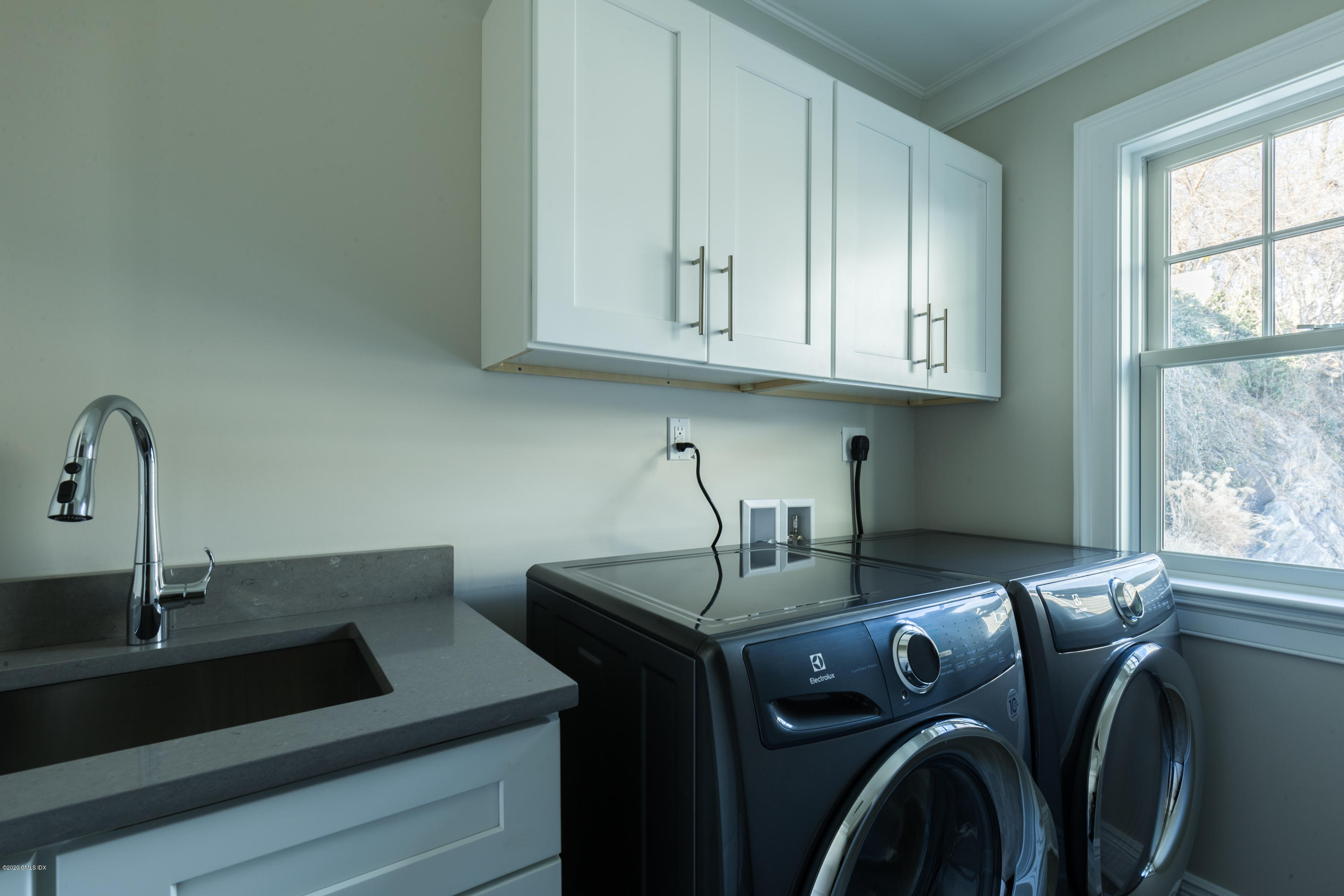 301 Davis Avenue, Unit B Greenwich, CT 06830 - Photo 13 of 16 a kitchen with stainless steel appliances granite countertop a sink a stove and dishwasher