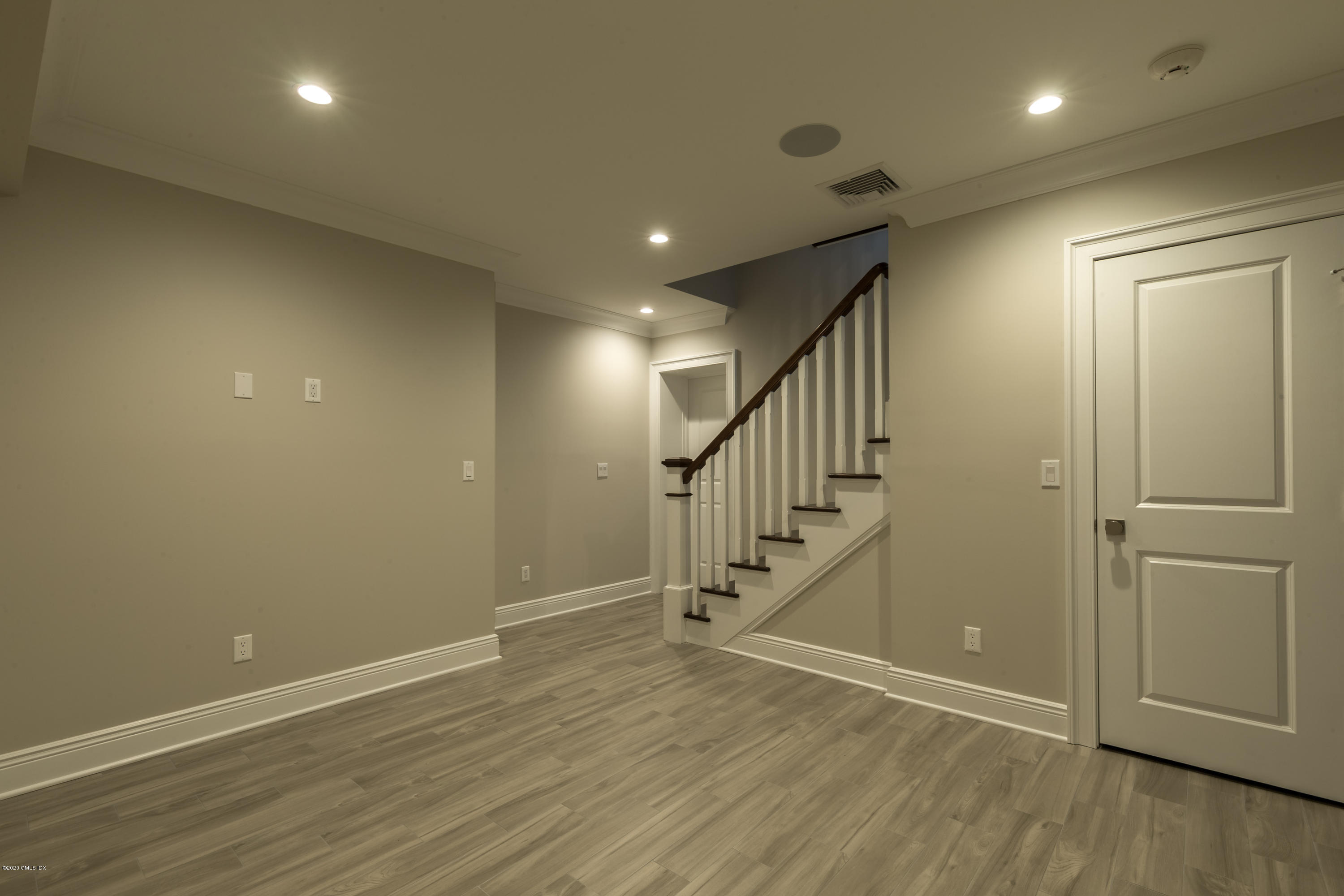 301 Davis Avenue, Unit B Greenwich, CT 06830 - Photo 14 of 16 a view of entryway with stairs and wooden floor