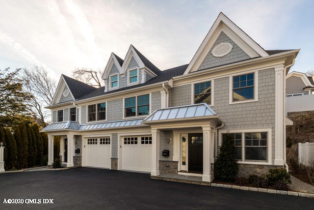 301 Davis Avenue, Unit B Greenwich, CT 06830 - Photo 2 of 16 a front view of a house with a yard