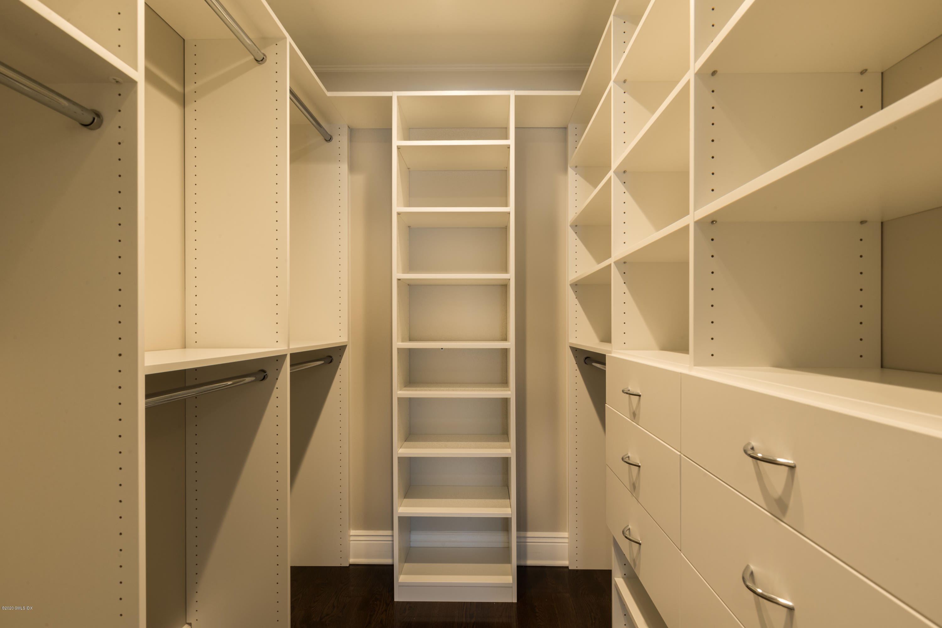 301 Davis Avenue, Unit B Greenwich, CT 06830 - Photo 8 of 16 a view of walk in closet with empty racks