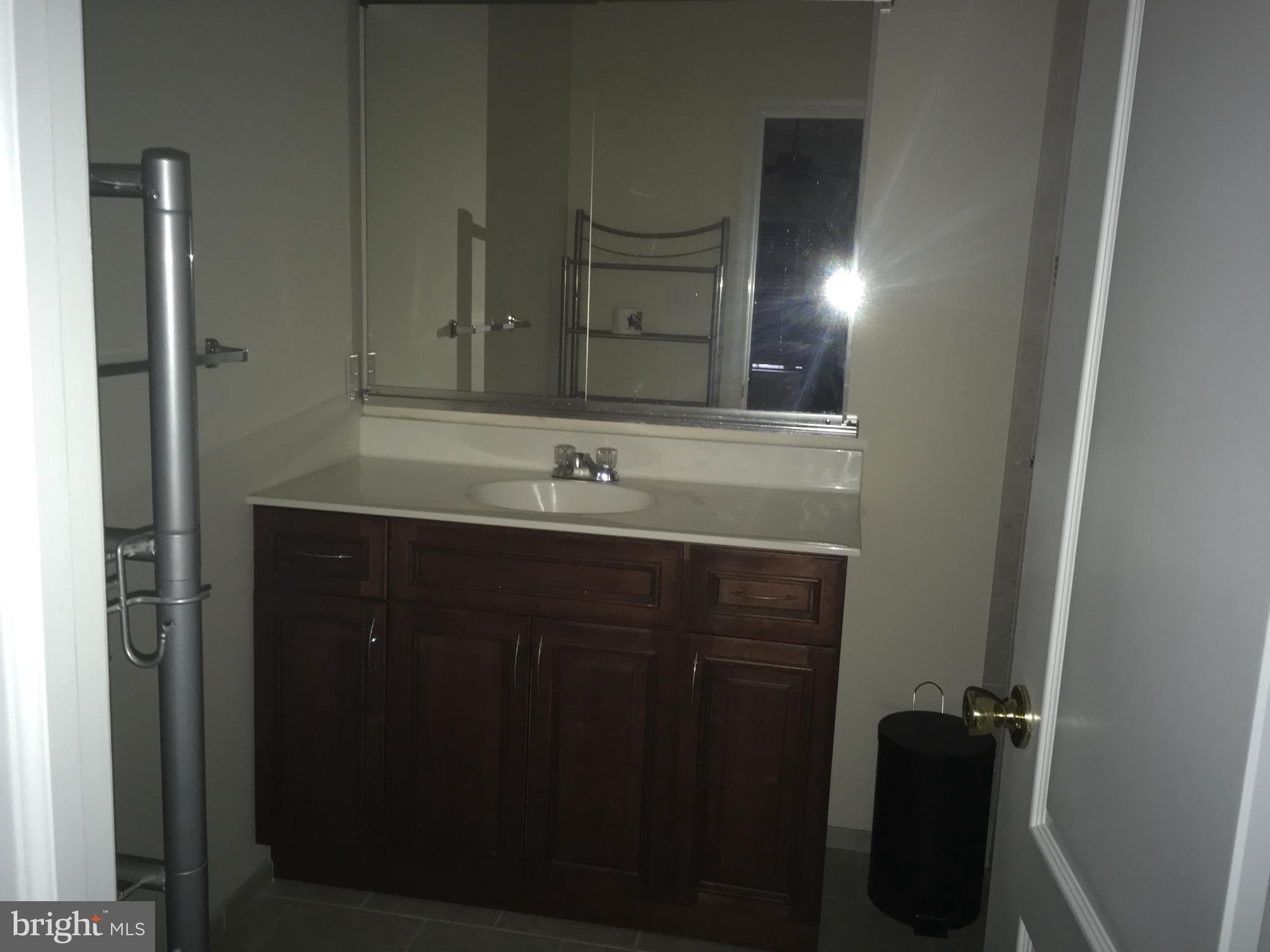 290 Byberry Road Philadelphia, PA 19116 - Photo 10 of 12 a bathroom with a sink and a mirror