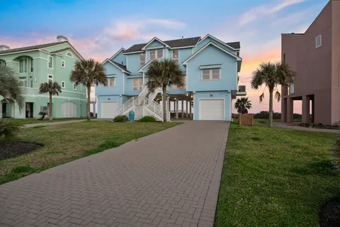 a view of multiple houses with a yard