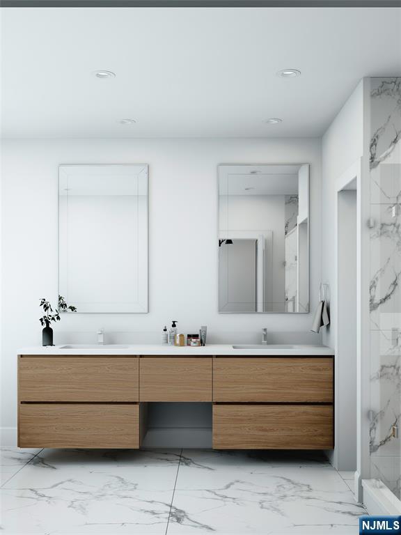 35 Feldman Court Paramus, NJ 07652 - Photo 16 of 24 a bathroom with a double vanity sink and a mirror
