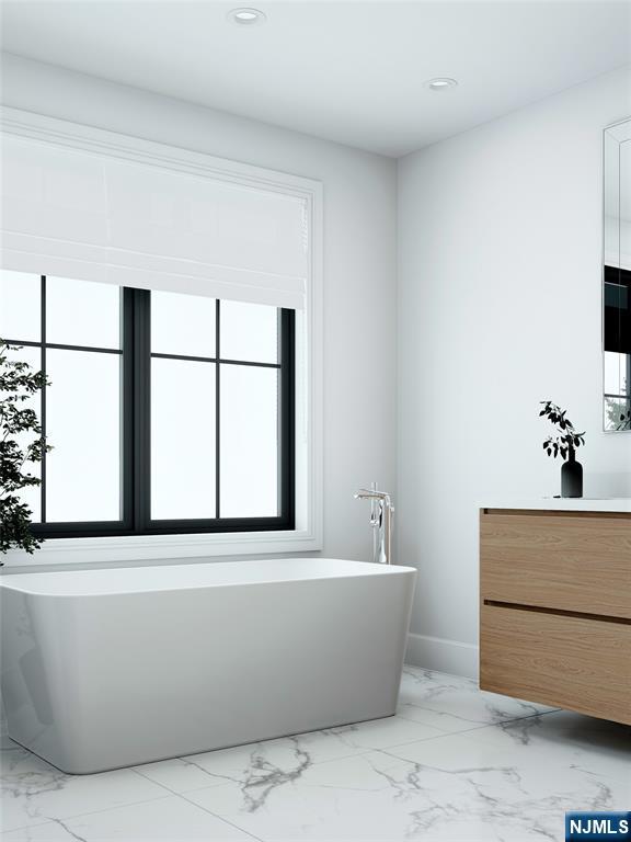 35 Feldman Court Paramus, NJ 07652 - Photo 18 of 24 a white bath tub sitting in a bathroom