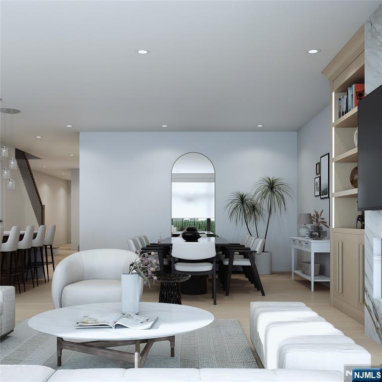 35 Feldman Court Paramus, NJ 07652 - Photo 9 of 24 a living room with furniture and a potted plant