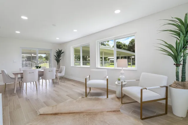 a view of a dining room with furniture window and outside view