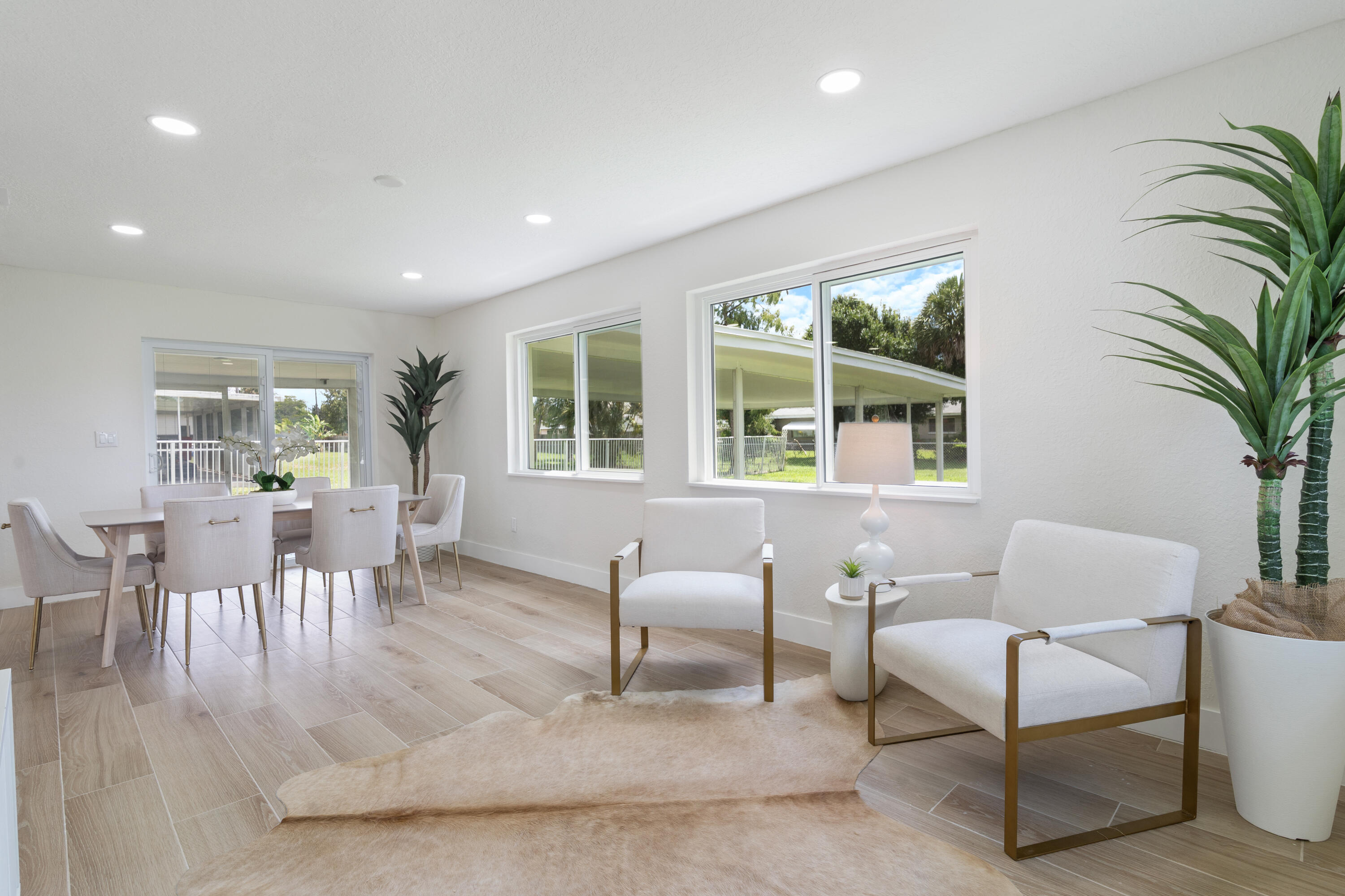 930 Rutherford Lane Haverhill, FL 33415 - Photo 12 of 25 a view of a dining room with furniture window and outside view