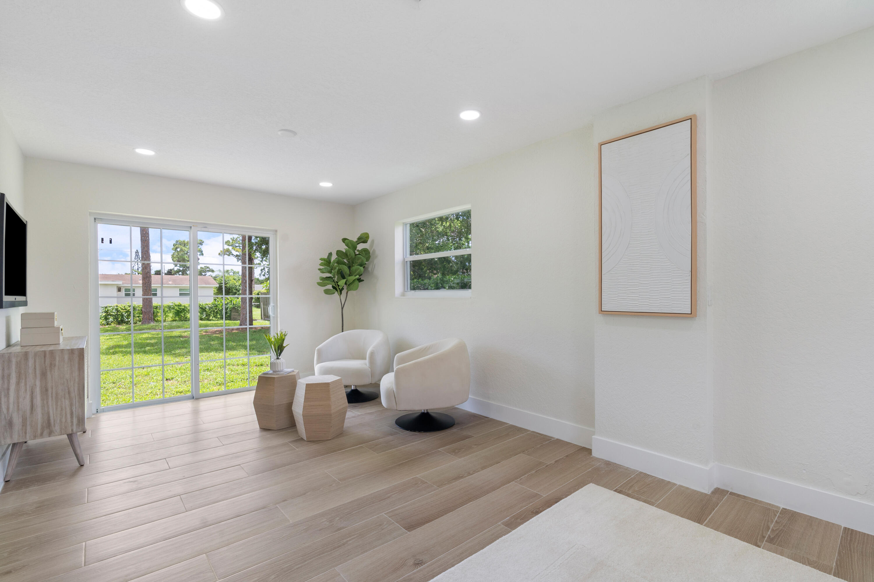 930 Rutherford Lane Haverhill, FL 33415 - Photo 14 of 25 a living room with furniture and garden view