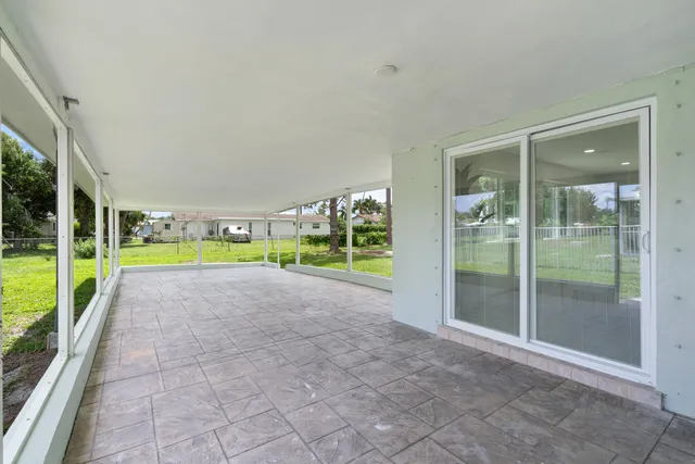 a view of a garden with an outdoor seating