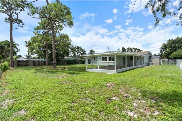 a view of a house with a big yard