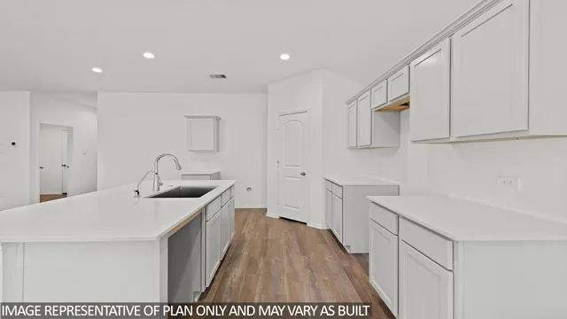a kitchen with a sink and cabinets