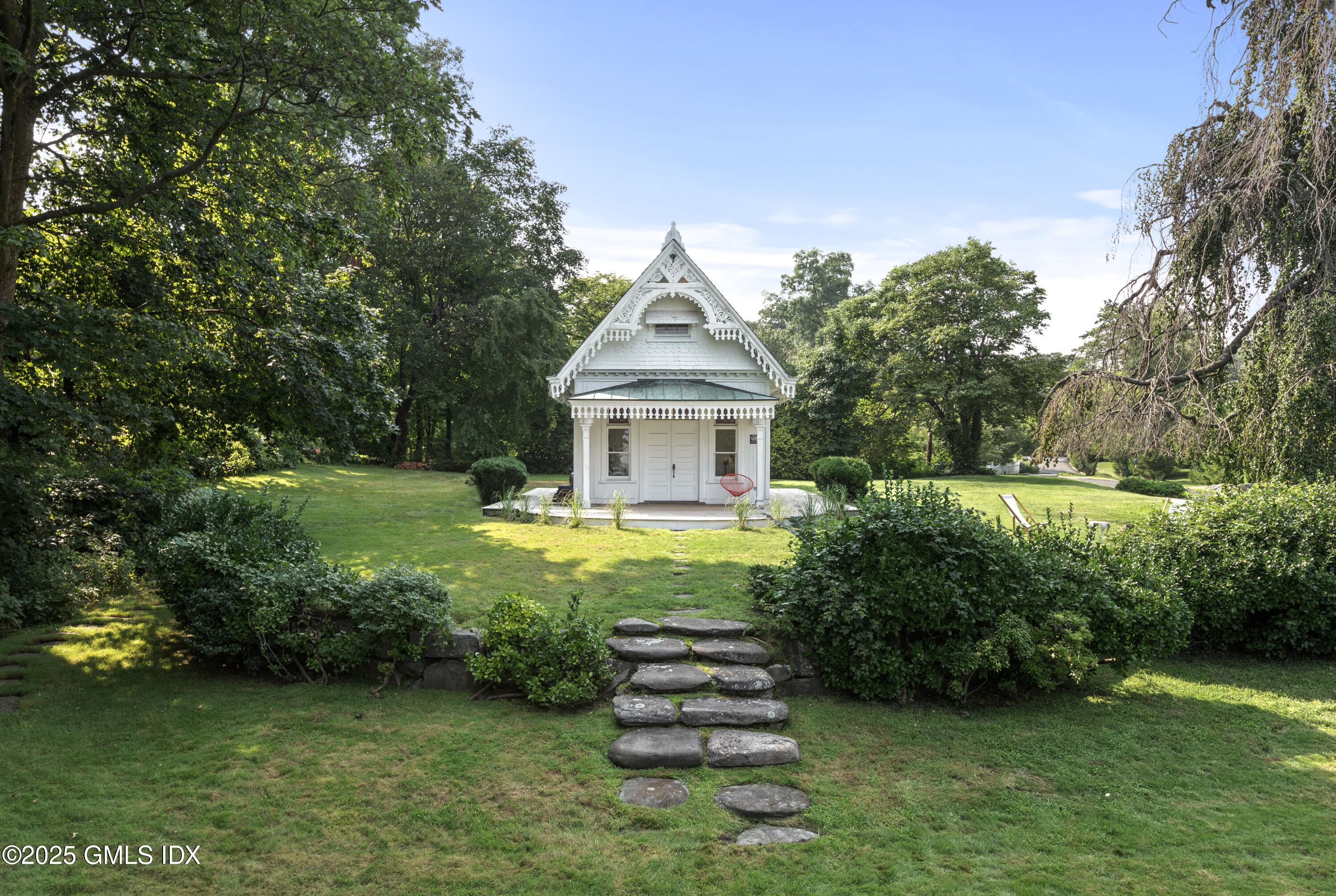 111 Byram Shore Road Greenwich, CT 06830 - Photo 17 of 23 a front view of a house with garden