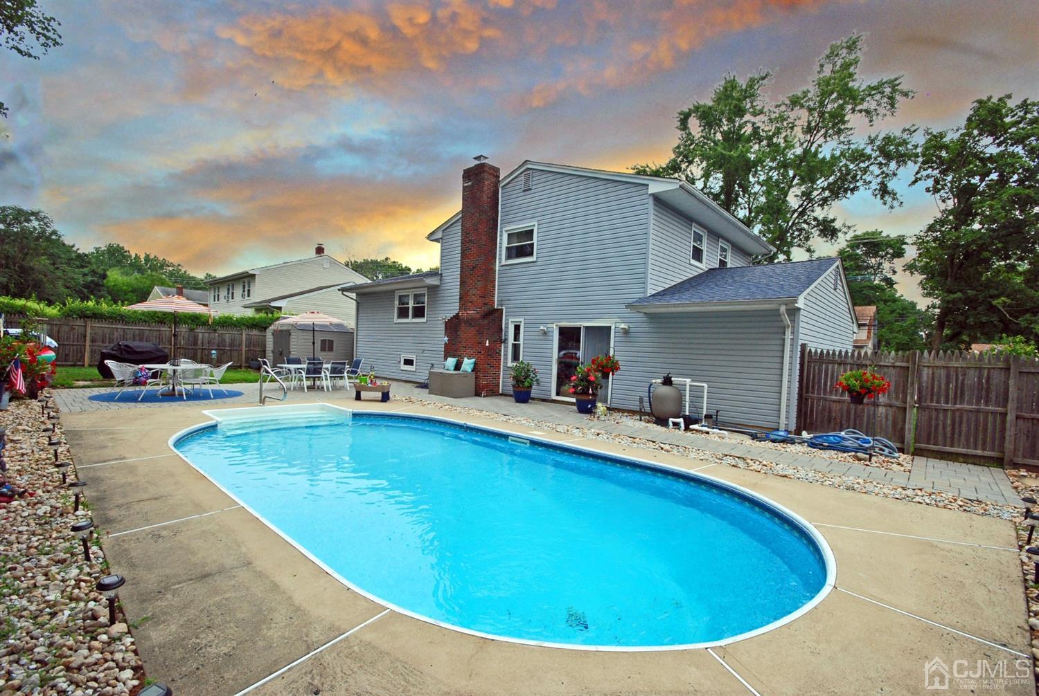 61 Greenbrook Road Middlesex, NJ 08846 - Photo 2 of 29 a view of a house with swimming pool and sitting area