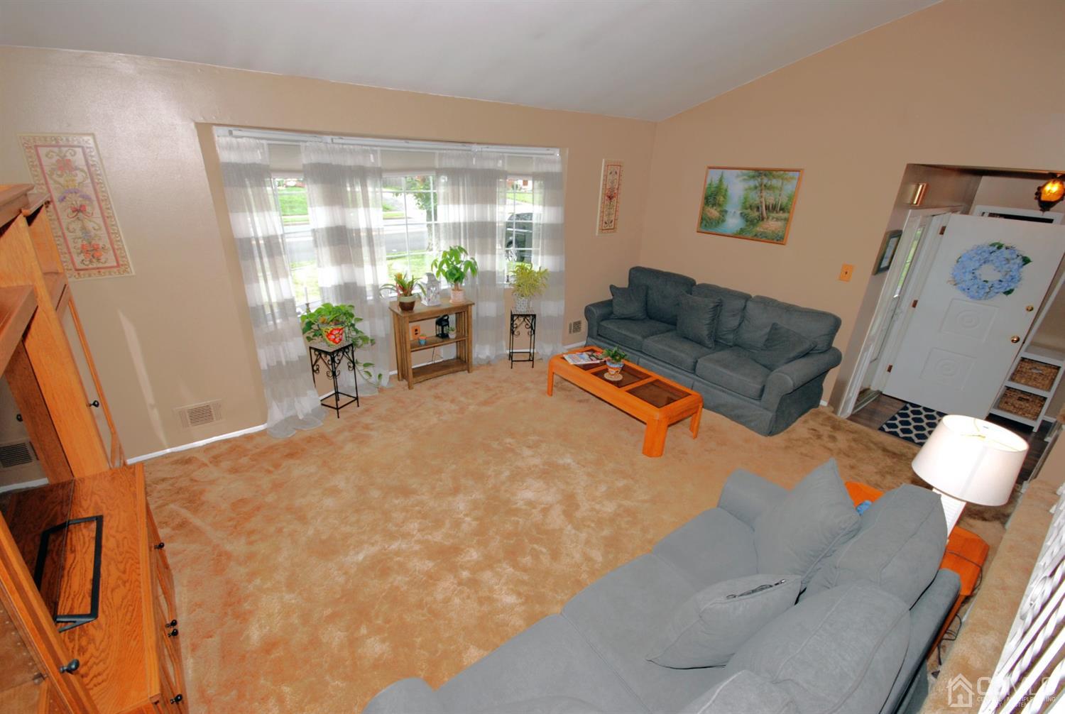 61 Greenbrook Road Middlesex, NJ 08846 - Photo 12 of 29 a bed room with furniture and a potted plant